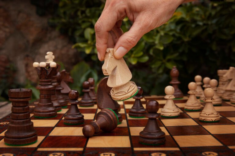 hand-playing-chess-classic-board (1)